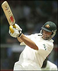 Adam Gilchrist hoists the ball for six