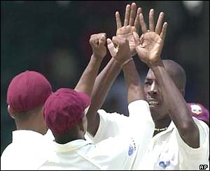 Vasbert Drakes celebrates the wicket of Darren Lehmann