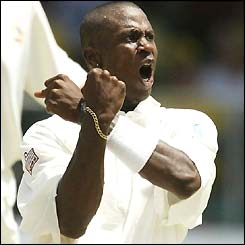Omari Banks celebrates the wicket of Andy Bichel