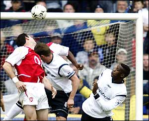 Martin Keown deflects Youri Djorkaeff's free-kick into his own goal for the Bolton equaliser
