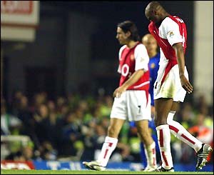 Patrick Vieira trudges off the field injured during the 2-2 draw with Man Utd