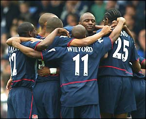 Arsenal players celebrate during their 4-1 victory at Leeds