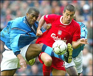 Milan Baros leads the push for an early goal 