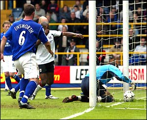 Richard Wright fumbles the ball into his own net just before the break