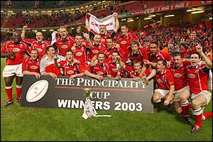 Llanelli players celebrate after winning the Principality Cup.