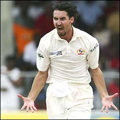 Jason Gillespie celebrates the wicket of Chris Gayle