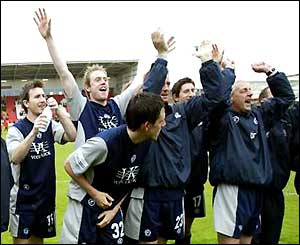 Chesterfield's players celebrate staying in Division Two