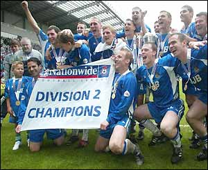 Wigan players celebrate the Divison Two championship