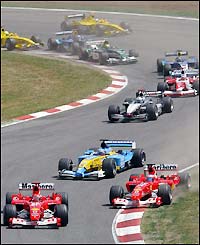 Michael Schumacher leads the pack off the grid 