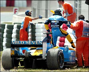 A dejected Jarno Trulli climbs out of his car
