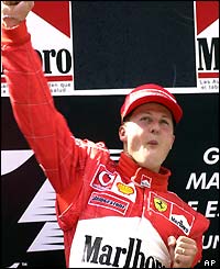 Michael Schumacher punches the air after winning the Spanish Grand Prix