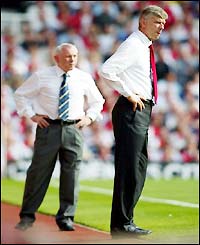 A disgruntled looking Arsene Wenger bellows the orders