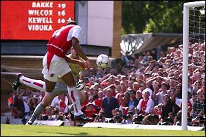 Thierry Henry coolly nods home the rebound from Parlour's shot 
