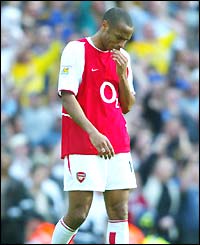 Arsenal's Thierry Henry is disappointed as his team have to settle for second in the Premiership