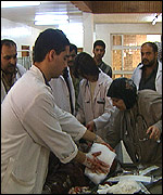 Doctors try to save the life of a victim of a drive-by shooting