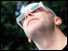 Man wears protective glasses to watch eclipse