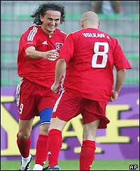 Sanli Tuncay and Volkan Arslan celebrate the winning goal