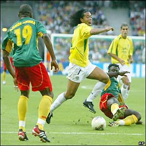 Ronaldinho is frustrated by the Cameroon defence