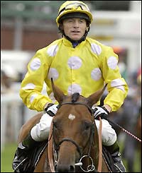 Kieren Fallon enters the winners' enclosure on Mr Dinos