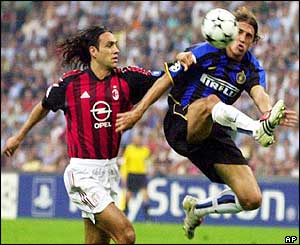 AC Milan's Alessandro Nesta challenges Inter's Hernan Crespo during the first-half of the match