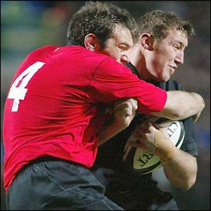 Wales' Robert Sidoli tackles Chris Jack