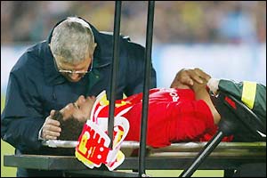 Colin Charvis is stretchered from the field