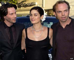 Keanu Reeves, left, Carrie-Anne Moss and Hugo Weaving
