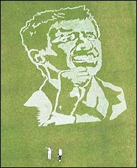 A picture of Tim Henman's face is printed on the playing fields of his old school