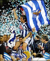 Real Sociedad striker Nihat Kahveci is carried by team-mates as they celebrate second place