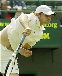 Andy Roddick blasts his trademark serve to opponent Davide Sanguinetti