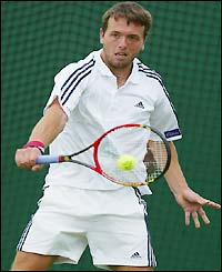 Great Britain's Lee Childs takes on Russian Nickolay Davydenko in the first round