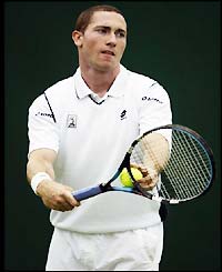 Scotland's Alan Mackin loses to Brazil's Flavio Saretta 6-2 6-4 6-2