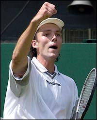Karlovic celebrates winning agaionst Lleyton Hewitt
