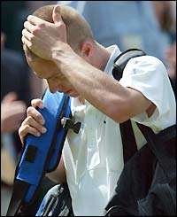 Lleyton Hewitt leaves Centre Court after his defeat