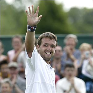Lee Childs shows off his Union flag sweatband as he salutes the crowd