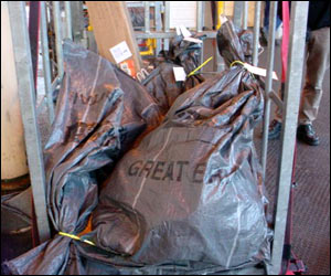 Sacks are loaded onto the train for the final time