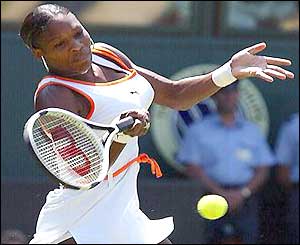 Serena Williams plays a forehand