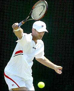 France's Cyril Saulnier plays a forehand on his way to victory