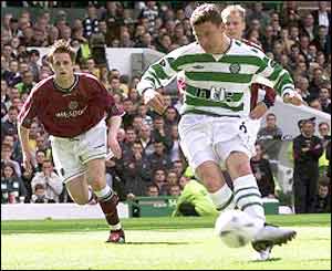 Celtic's Alan Thompson strikes his penalty towards goal