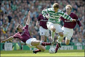 Celtic midfielder Stilian Petrov tries to burst through the Hearts defence