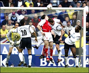 Martin Keown scores an own goal against Bolton