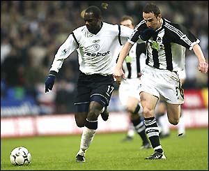Michael Ricketts runs at the Newcastle defence