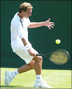 David Nalbandian plays a backhand