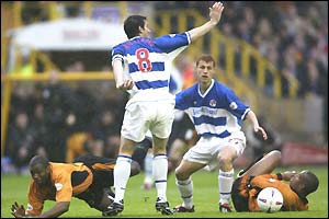 Wolves striker Nathan Blake is grounded by Reading skipper Adrian Williams