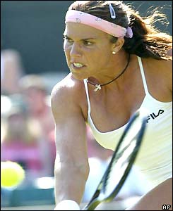 Jennifer Capriati stoops to play a backhand volley