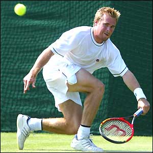 Mark Hilton reaches a forehand