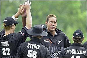 Daryl Tuffey is congratulated for removing Mohammad Hafeez