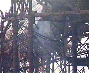Brighton's West Pier smoulders after a second fire in May 2003