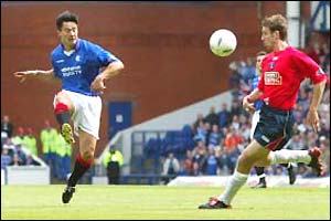 Mols lobs the ball over the Kilmarnock keeper for Rangers' second goal