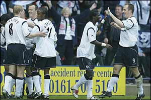 Bolton players celebrate Jay-Jay Okocha's goal after 21 minutes